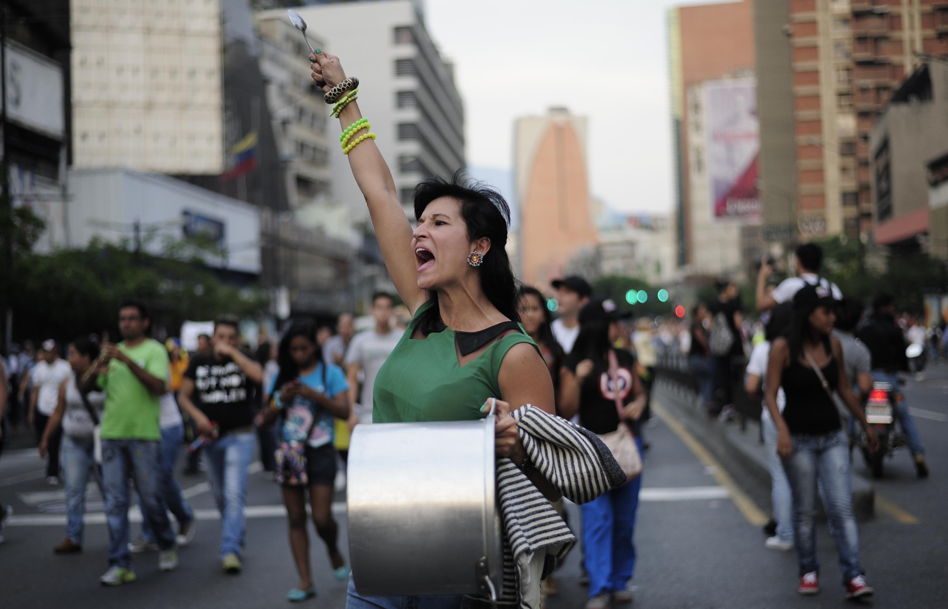 Supporters of Venezuelan opposition presidential candidate Henrique Capriles protest in the area of Altamira, in Caracas, capital of Venezuela, on Monday. (Image credit: Xinhua/Landov)