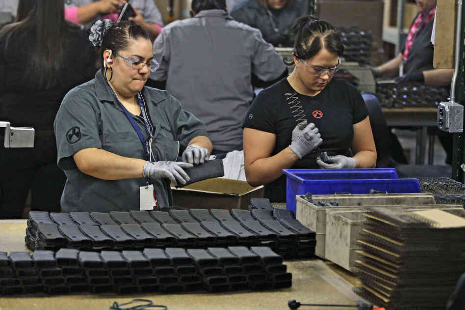 Workers assemble 30-round capacity magazines at the Magpul Industries plant in Erie, Colo. The company, which employs 200 people, says it plans to move its entire operation out of the state. Workers assemble 30-round capacity magazines at the Magpul Industries plant in Erie, Colo. The company, which employs 200 people, says it plans to move its entire operation out of the state.