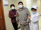 An H7N9 bird flu patient is escorted after his recovery and approval for discharge at a central China hospital on Friday. An H7N9 bird flu patient is escorted after his recovery and approval for discharge at a central China hospital on Friday.