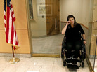 Jennifer Longdon, who survived gun violence but was left a paraplegic, wiped away tears at an April 19, 2013 protest at Arizona Republican Sen. Jeff Flake's Phoenix office. Jennifer Longdon, who survived gun violence but was left a paraplegic, wiped away tears at an April 19, 2013 protest at Arizona Republican Sen. Jeff Flake's Phoenix office.