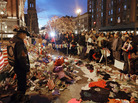 People gather at a makeshift memorial for victims of the Boston Marathon bombings at the edge of the still-closed section of Boylston Street. The surviving suspect in the case, Dzhokhar Tsarnaev, remains in the hospital. People gather at a makeshift memorial for victims of the Boston Marathon bombings at the edge of the still-closed section of Boylston Street. The surviving suspect in the case, Dzhokhar Tsarnaev, remains in the hospital.