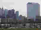 The Cira Centre, right, was illuminated Friday night with LED lights, transforming it into a giant screen to play the video game Pong.