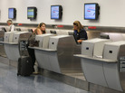 An American Airlines passenger is helped at the ticket counter at Miami International Airport last week. Many airline industry observers expect delays to strike Monday, the first full day of FAA furloughs. An American Airlines passenger is helped at the ticket counter at Miami International Airport last week. Many airline industry observers expect delays to strike Monday, the first full day of FAA furloughs.