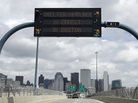 A sign on I-93 alerts motorists that Boston is under a "shelter in place" order Friday. A sign on I-93 alerts motorists that Boston is under a "shelter in place" order Friday.