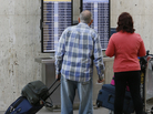 Passengers check their flight status at Los Angeles International airport on Monday. The FAA said staffing cuts were causing delays in the Eastern U.S. Passengers check their flight status at Los Angeles International airport on Monday. The FAA said staffing cuts were causing delays in the Eastern U.S.