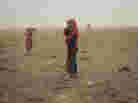 Hovorerden plays with his sister during a sand storm. Mongolia, Gobi, Omongovi, 2012.