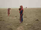 Hovorerden plays with his sister during a sand storm. Mongolia, Gobi, Omongovi, 2012.
