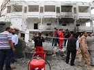 Libyan security forces gather outside the French Embassy in Tripoli following a car bomb blast on Tuesday. Libyan security forces gather outside the French Embassy in Tripoli following a car bomb blast on Tuesday.