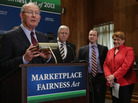 Sen. Lamar Alexander, R-Tenn. (left), leads a news conference about the Marketplace Fairness Act on Tuesday. The legislation would provide states with the authority to require out-of-state retailers to collect and remit taxes on purchases shipped into the states. Sen. Lamar Alexander, R-Tenn. (left), leads a news conference about the Marketplace Fairness Act on Tuesday. The legislation would provide states with the authority to require out-of-state retailers to collect and remit taxes on purchases shipped into the states.