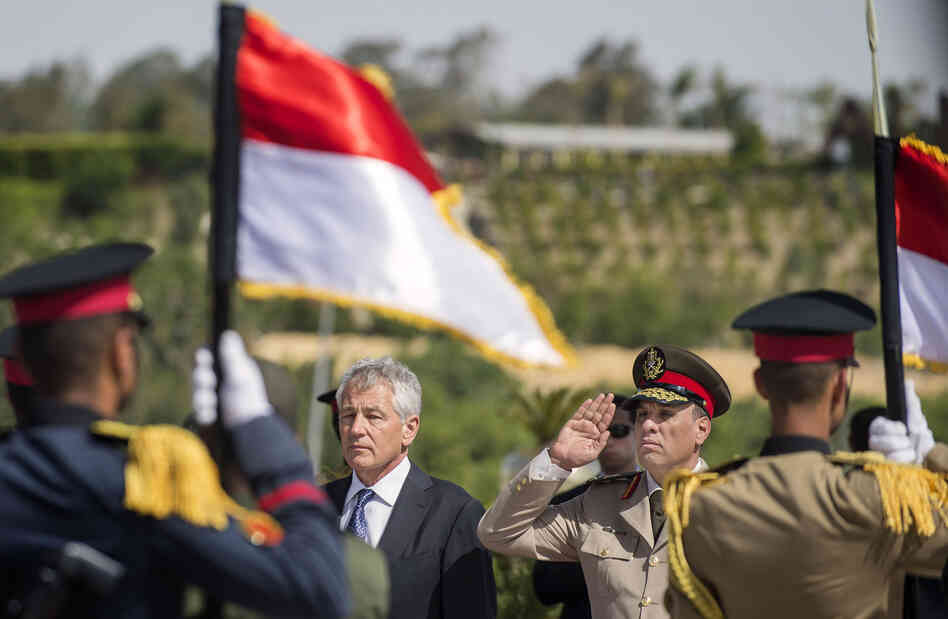 U.S. Secretary of Defense Chuck Hagel stands with an Egyptian army official as he salutes before laying a wreath at the Tomb of the Unknown Soldier on Wednesday in Cairo, Egypt. U.S. Secretary of Defense Chuck Hagel stands with an Egyptian army official as he salutes before laying a wreath at the Tomb of the Unknown Soldier on Wednesday in Cairo, Egypt.