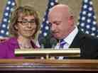 Former Arizona Rep. Gabrielle Giffords and her husband, Mark Kelly, at an April 16 ceremony naming a Capitol Hill conference room for her aide Gabe Zimmerman. Zimmerman died in the same Tucson, Ariz., shootings that Giffords wounded.