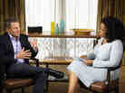 Oprah Winfrey speaks with Lance Armstrong during an interview.