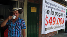A Colombian farmer sips cofee during a national coffee producers' strike Feb. 25 in Colombia. Thousands of coffee farmers rallied and marched throughout Colombia in protest the economic difficulties of the sector. A Colombian farmer sips cofee during a national coffee producers' strike Feb. 25 in Colombia. Thousands of coffee farmers rallied and marched throughout Colombia in protest the economic difficulties of the sector.