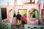 The community of El Ayllu in Lima, Peru, has been demolished to make way for an airport expansion. Residents received money to relocate, but their historic sense of community cannot be rebuilt. Here, Ricardo Galvez, Giovanna Meneses Pisco and Arely Betzabe stand in front of their former home in El Ayllu. The family was back in the neighborhood to gather some of their belongings.