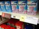 A sign limiting the purchase of baby formula powder hangs on a shelf in a London supermarket April 10.