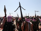 Iraqi anti-government gunmen from Sunni tribes in western Anbar province march during a protest in Ramadi, west of Baghdad, Friday. Iraqi anti-government gunmen from Sunni tribes in western Anbar province march during a protest in Ramadi, west of Baghdad, Friday.