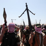 Iraqi anti-government gunmen from Sunni tribes in western Anbar province march during a protest in Ramadi, west of Baghdad, Friday.