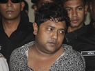 Sohel Rana, the fugitive owner of an illegally constructed building that collapsed last week in Bangladesh, killing some 377 people, is paraded by Rapid Action Battalion commandoes for the media in Dhaka, Bangladesh, on Sunday. Sohel Rana, the fugitive owner of an illegally constructed building that collapsed last week in Bangladesh, killing some 377 people, is paraded by Rapid Action Battalion commandoes for the media in Dhaka, Bangladesh, on Sunday.