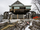 A home damaged by Superstorm Sandy in Union Beach, N.J., sits on a raised platform to protect it from future flooding. A home damaged by Superstorm Sandy in Union Beach, N.J., sits on a raised platform to protect it from future flooding.