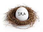 A white egg in a nest on a white background with the word IRA on the egg. A white egg in a nest on a white background with the word IRA on the egg.