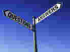 Street signs at an intersection. One says: questions. The other says: answers. Street signs at an intersection. One says: questions. The other says: answers.
