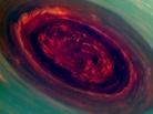 A mammoth spinning vortex is seen on Saturn, in this "false-color" photograph released by NASA Monday. The image was captured by the Cassini spacecraft. A related image, presenting what a human eye would see, is farther down this page. A mammoth spinning vortex is seen on Saturn, in this "false-color" photograph released by NASA Monday. The image was captured by the Cassini spacecraft. A related image, presenting what a human eye would see, is farther down this page.