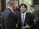 Californian State Assemblyman Richard Pan (center) is the author of legislation that would bar higher prices for health insurance sold to smokers.