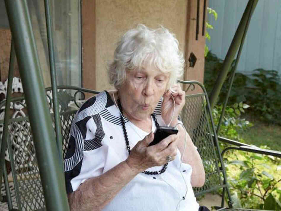 Woman listening to headphones. Woman listening to headphones.
