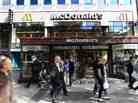 Fast times on the Champs-Elysees: People walk past a McDonald's on one of Paris' most storied avenues. But it's not just McD's that has caught French interest: Fast food now accounts for the majority of restaurant spending in the country.