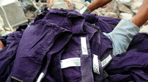 An item of clothing with a Joe Fresh label lies in the rubble after a multistory building collapsed in Savar, Bangladesh.