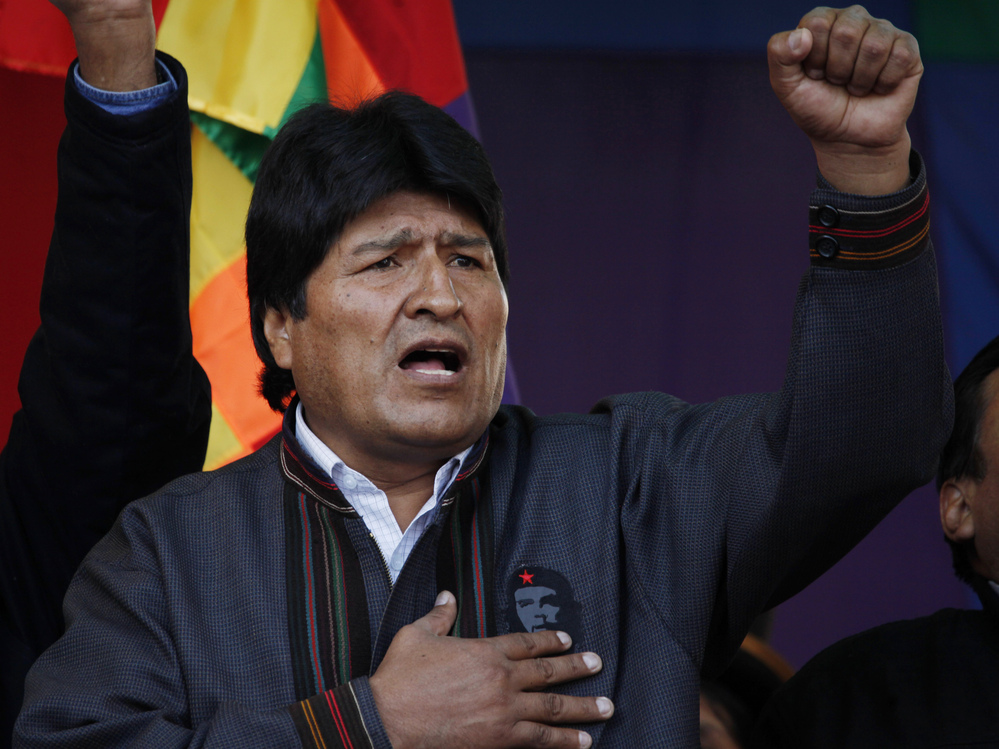 Bolivian President Evo Morales sings his national anthem during the annual May Day march in La Paz on Wednesday. He announced during a speech that he was expelling the U.S. Agency for International Development from the country.