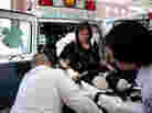 Celeste Corcoran is transported to Spaulding Rehabilitation Hospital on April 28.