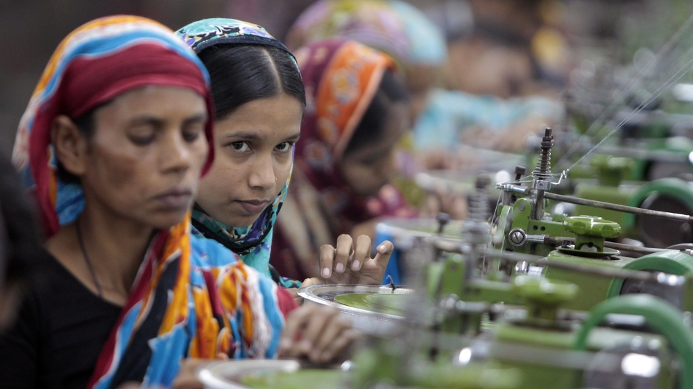 Workers manufacture clothing in a factory near Dhaka, Bangladesh, in December. Labor activists and major clothing retailers met in Germany this week to try to hammer out a deal that would improve working conditions in Bangladeshi factories.