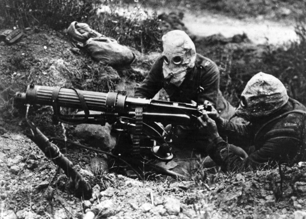 Soldiers with the British Machine Gun Corps wear gas masks in 1916 during World War I's first Battle of the Somme.