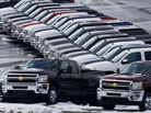 Chevy trucks line the lot of a dealer in Murrysville, Pa. Sales were up by double digits at Chrysler, General Motors and Ford last month. Chevy trucks line the lot of a dealer in Murrysville, Pa. Sales were up by double digits at Chrysler, General Motors and Ford last month.