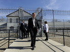 Colorado Governor John Hickenlooper, center, exits the Fort Lyon Correctional Facility in Las Animas, Colo., on Wednesday after touring the facility. Hickenlooper has proposed closing the facility due to budget concerns. Colorado Governor John Hickenlooper, center, exits the Fort Lyon Correctional Facility in Las Animas, Colo., on Wednesday after touring the facility. Hickenlooper has proposed closing the facility due to budget concerns.
