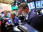 Traders work on the floor of the New York Stock Exchange after the morning bell on May 1. Traders work on the floor of the New York Stock Exchange after the morning bell on May 1.