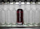 A bottle of Cleveland Whiskey's bourbon sits on a shelf with empty bottles at the company's distillery.