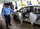 Pakistani police officials examine the bloodied, bullet-riddled car of slain government prosecutor Chaudhry Zulfiqar Ali after an attack by gunmen Friday in Islamabad. Pakistani police officials examine the bloodied, bullet-riddled car of slain government prosecutor Chaudhry Zulfiqar Ali after an attack by gunmen Friday in Islamabad.