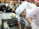 Employees scoop ice cream, which is topped with pistachios, at Bakdash's opening in Amman, Jordan, this week. Bakdash has been a landmark in Damascus, Syria, since 1895. But the war there has made it hard to get supplies, so the owners have set up a new shop in Amman. Employees scoop ice cream, which is topped with pistachios, at Bakdash's opening in Amman, Jordan, this week. Bakdash has been a landmark in Damascus, Syria, since 1895. But the war there has made it hard to get supplies, so the owners have set up a new shop in Amman.
