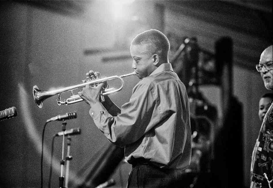 Bolen shot one of Troy "Trombone Shorty" Andrews' earliest public performances at the 2001 Jazz Fest. Andrews' teacher Clyde Kerr can be seen at the far right. Bolen shot one of Troy "Trombone Shorty" Andrews' earliest public performances at the 2001 Jazz Fest. Andrews' teacher Clyde Kerr can be seen at the far right.