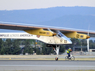 The Solar Impulse takes off from Moffett Field NASA Ames Research Center in Mountain View, Calif., Friday, as a team member rides an electric bike alongside the plane. The Solar Impulse takes off from Moffett Field NASA Ames Research Center in Mountain View, Calif., Friday, as a team member rides an electric bike alongside the plane.