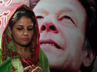 An Imran Khan supporter prays on Tuesday for his quick recovery after he was rushed to a hospital with head injuries. An Imran Khan supporter prays on Tuesday for his quick recovery after he was rushed to a hospital with head injuries.