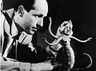 American film animator and special effects creator Ray Harryhausen with one of his creations in 1965. American film animator and special effects creator Ray Harryhausen with one of his creations in 1965.