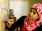Yusra Hammed, 15, puts the finishing touches on a drawing on a wall inside her family's home in Silwad, a village in the West Bank. Hammed says, like many Palestinian girls, she does not throw rocks at Israeli soldiers; but she expresses her opposition through alternate channels, such as art. Yusra Hammed, 15, puts the finishing touches on a drawing on a wall inside her family's home in Silwad, a village in the West Bank. Hammed says, like many Palestinian girls, she does not throw rocks at Israeli soldiers; but she expresses her opposition through alternate channels, such as art.