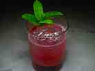 World Shattered, a cocktail by Tyler Fry of the Chicago bar The Violet Hour. The drink includes R. Franklin's Original Recipe Malort, and tames the bitterness with lemon, honey syrup, raspberry and mint.