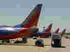 Southwest airline jets are lined up at Long Island MacArthur Islip airport in 2010. Departures at the New York City suburban airport dropped nearly 50 percent between 2007 and 2012, according to an MIT study.