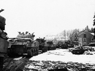 British tanks move to support their infantry during the Battle of the Bulge. British tanks move to support their infantry during the Battle of the Bulge.