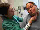Nurse Practioner Tina Clark examines Anastacia Casperson at the Glide Health Clinic in San Francisco. Nurse Practioner Tina Clark examines Anastacia Casperson at the Glide Health Clinic in San Francisco.