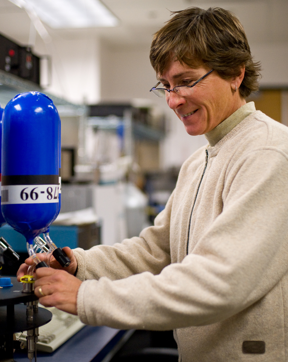 Pat Lang, of NOAA in Boulder, Colo., measures the amount of greenhouse gases from an air sample. The Boulder lab is part of a global network of air-sampling laboratories that track carbon dioxide levels in the atmosphere.